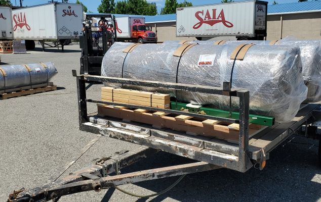 Multiple SMS breeding phantoms fully shrink-wrapped and palletized on a trailer ready for freight shipping and air cargo transit.
